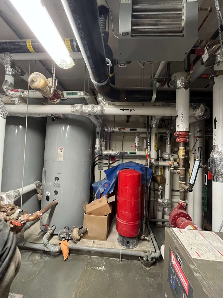 Industrial boilers and heat-pump units dusty and unmaintained before HRPM intervention.