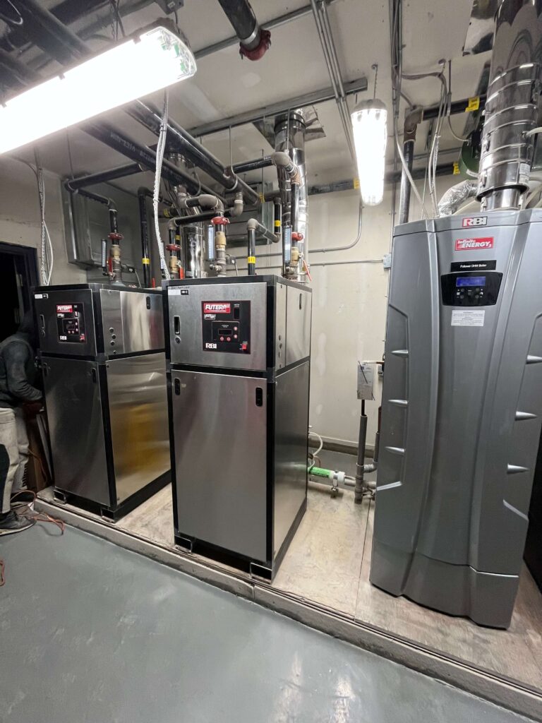 Mechanical room floor units and upper ductwork covered in fine dust pre-dusting.