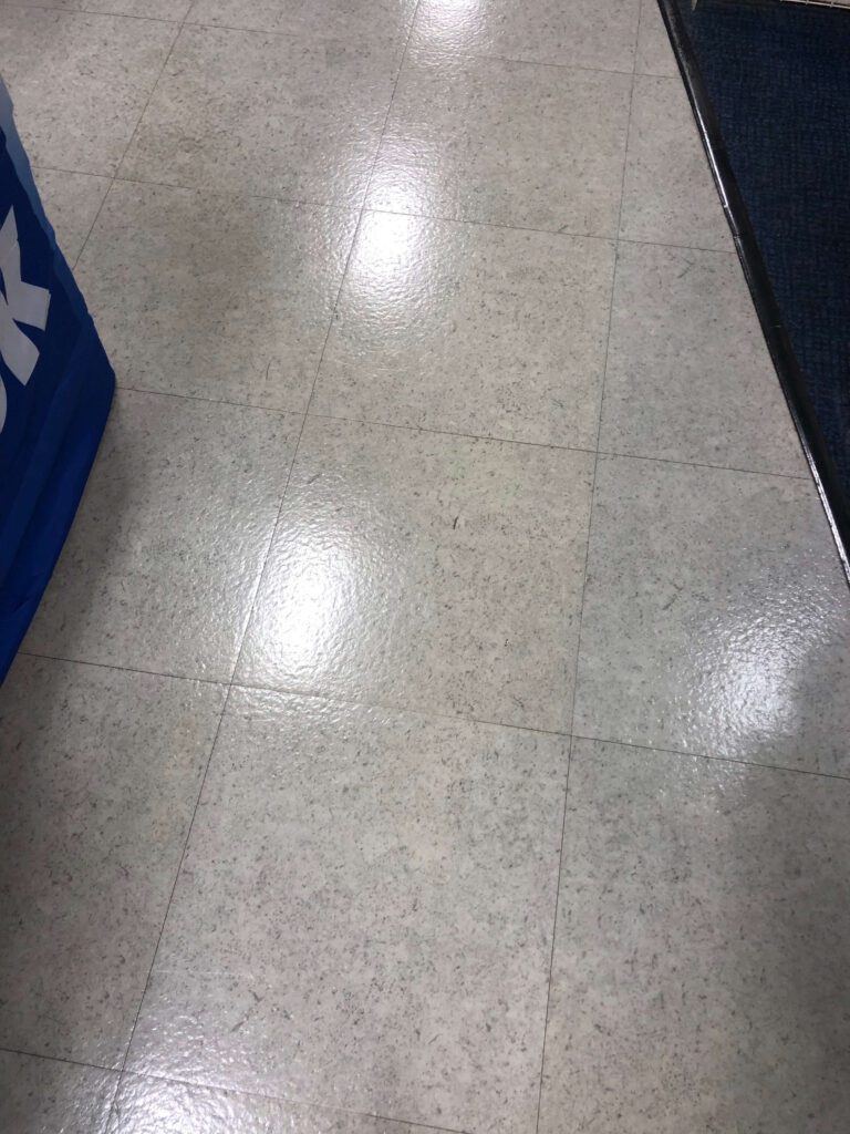 Polished commercial retail tile floor in front of modular display units